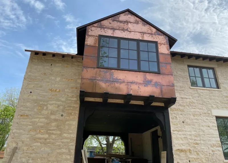 Copper metal panel facade on a stone building for Metal Roof Coating in Lake Monticello