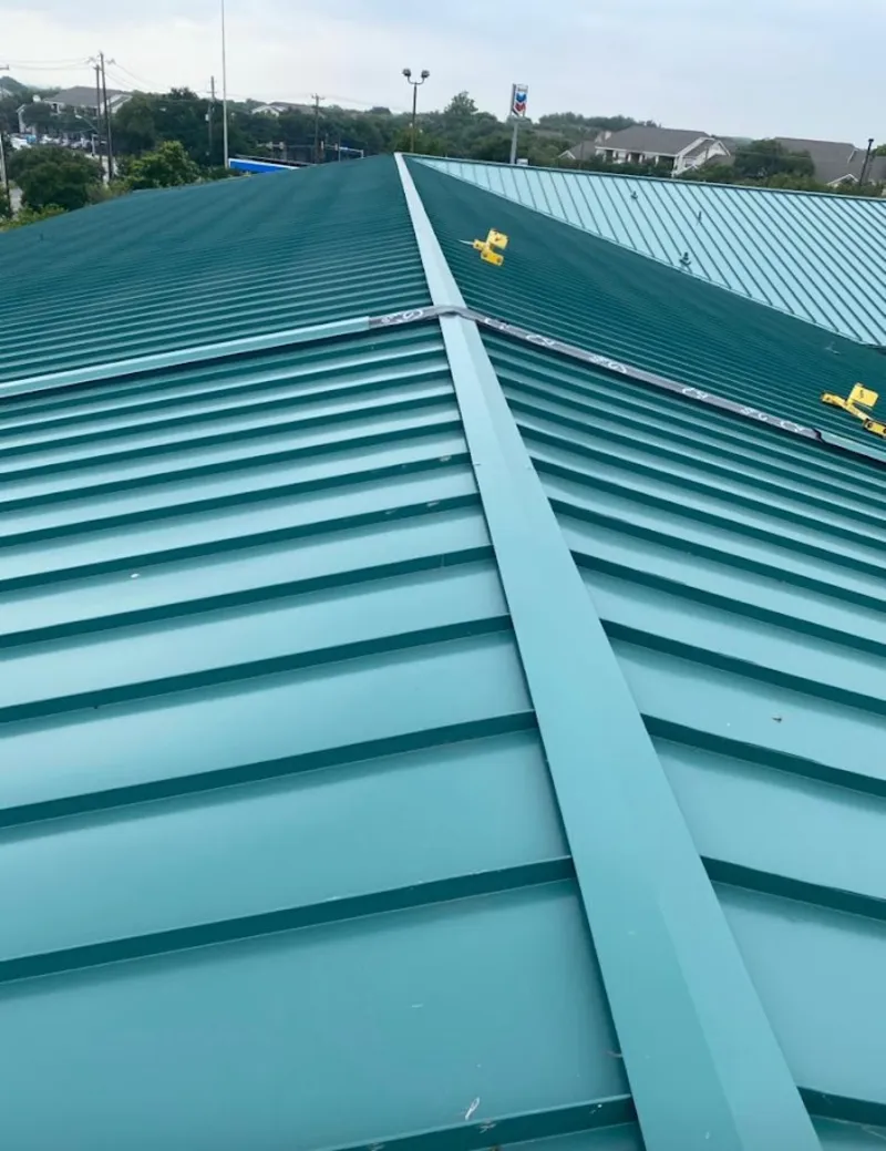 Green commercial metal roof ridge and valley for Metal Roof Repair in Lake Monticello